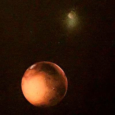Comparison of original rendering (top) and photo of actual mural (bottom). Ceres at top of each image, Mars below.