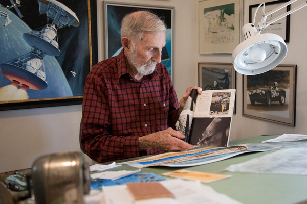 Pierre holds the issue of National Geographic with his illustration of Eagle seconds before landing