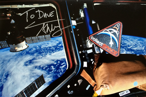 collectSPACE patch floating on the International Space Station. Design by Dave Ginsberg